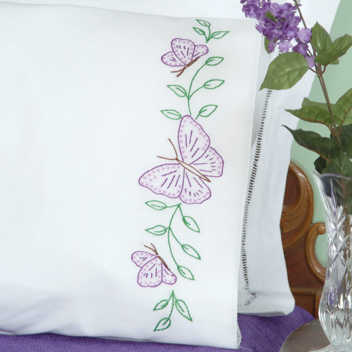 Beautiful pair of vintage cross stitched butterfly pillowcases