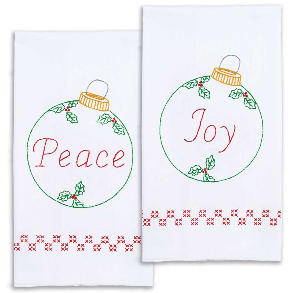 Decorative hand towel kit featuring Peace and Joy Christmas ornaments for hand embroidery
